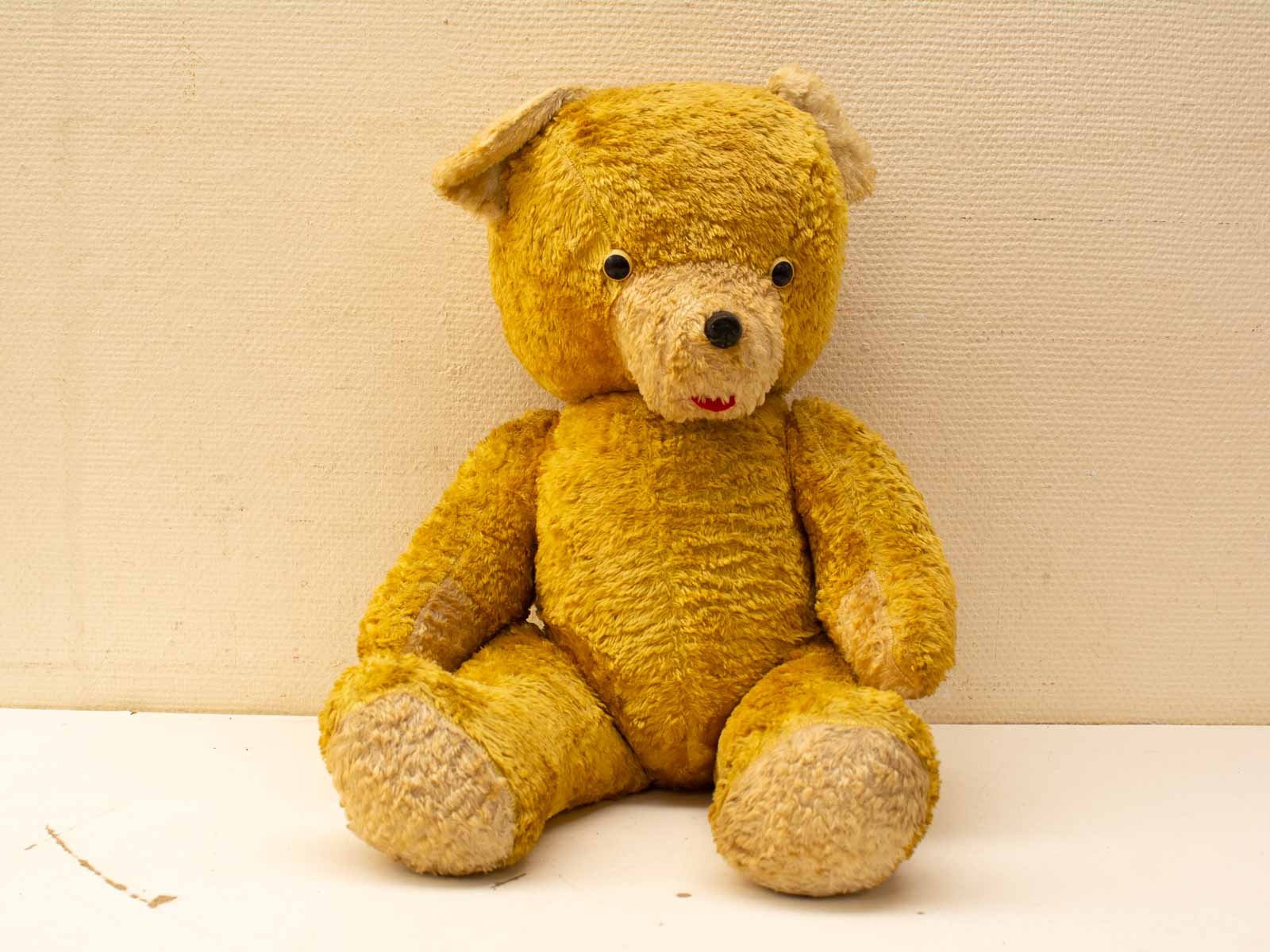 Nostalgic yellow teddy bear exuding warmth, perfect for cuddles and cherished memories.