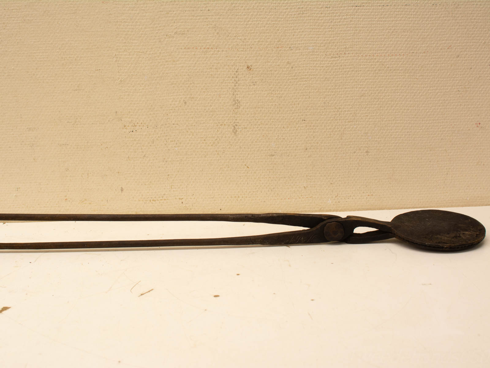 Rustic vintage metal tongs, perfect for cooking, serving, and adding charm to any kitchen.