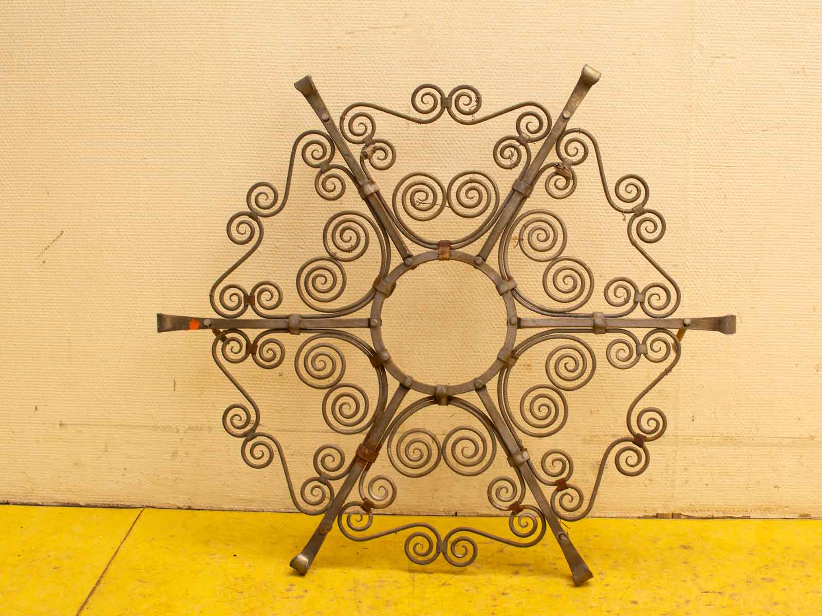 Elegant vintage wrought iron floral art piece, adding sophistication and charm to any décor.